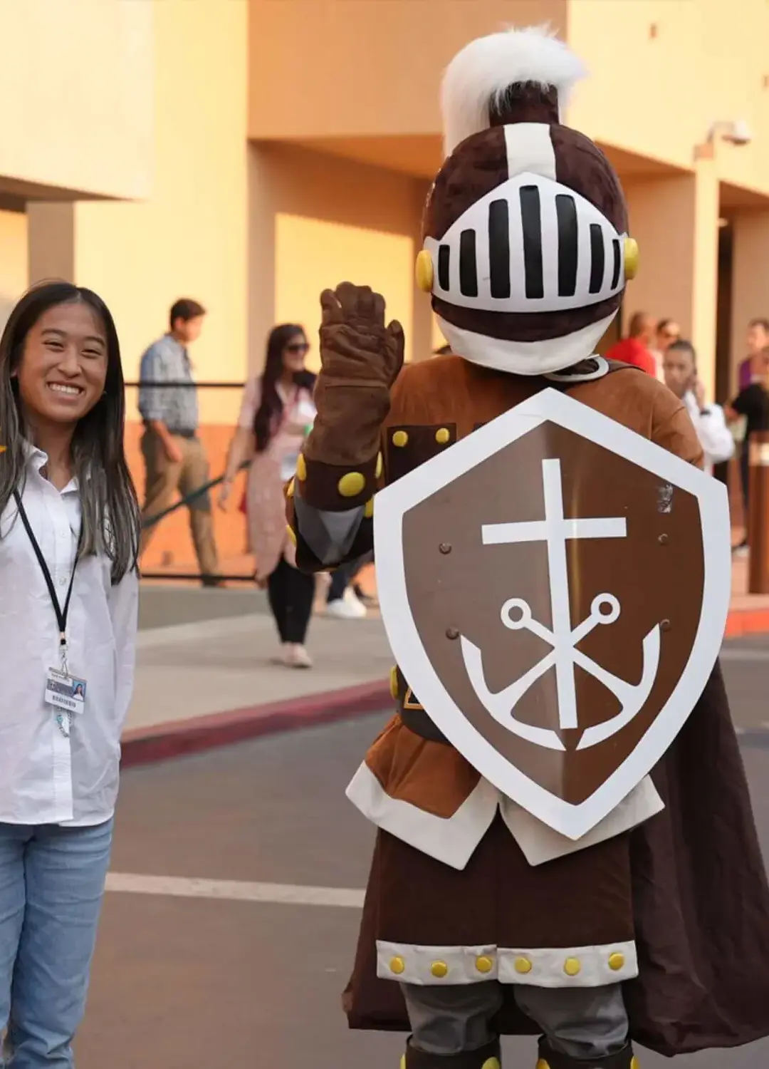 Our mascot Lancelot and a student welcome you to campus.