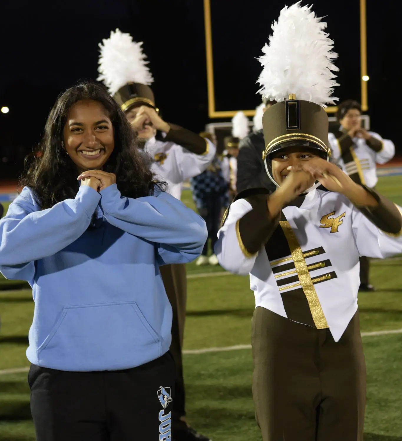 Megha Goshike ‘28 teaches marching basics.