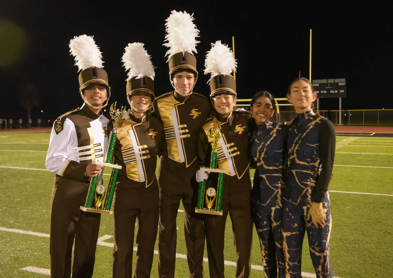 Anay Shah ‘25, Theoren Djurovic ‘27, Jamie Ramprashad ‘26, Kylie Brown ‘25, Anya Mathew ‘26, and Zoe Scallon ‘26 at Rodriguez Tournament of Champions 2024. Lancer Band and Color Guard received second place in their division and fourth place drum major overall.