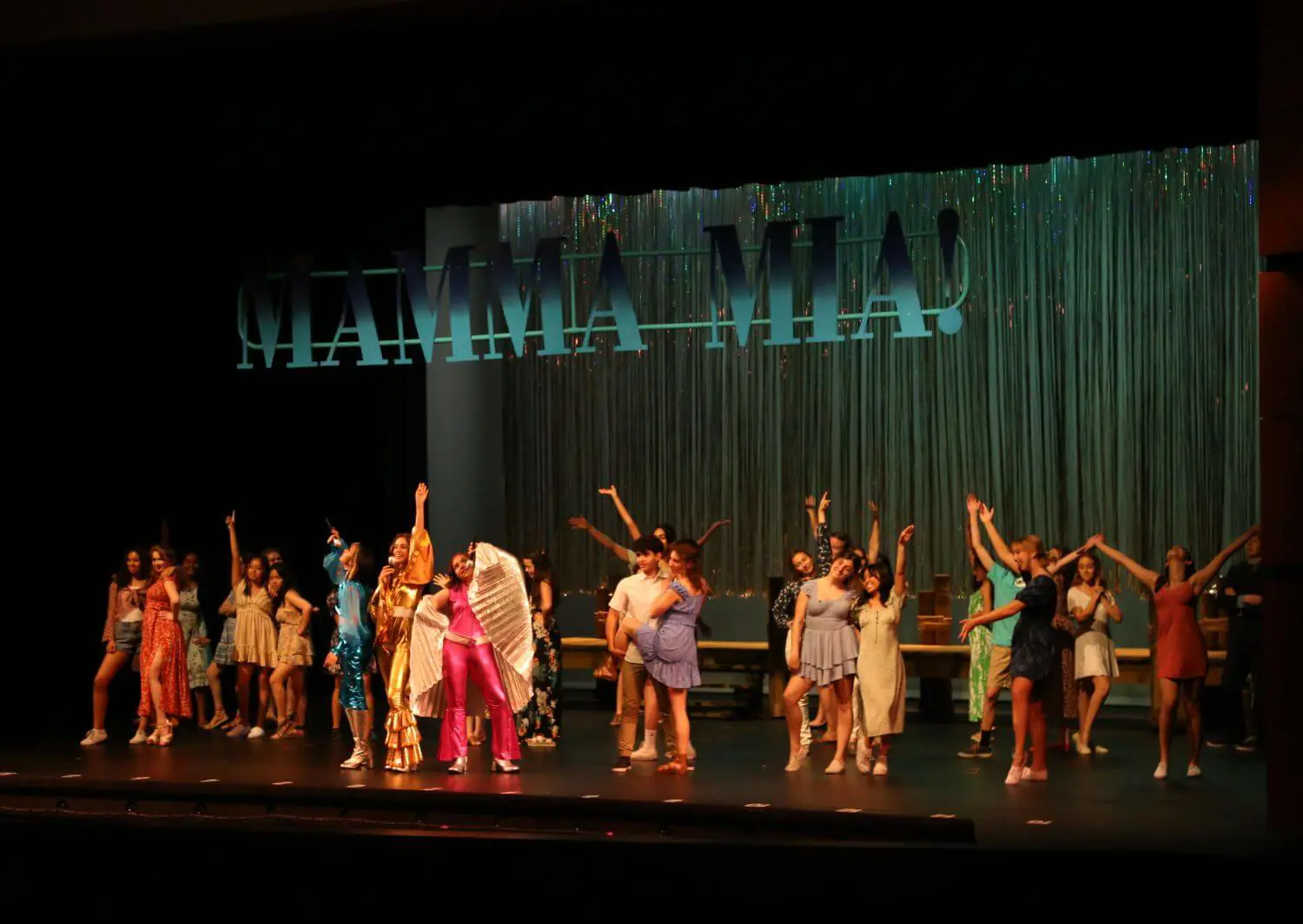 The cast strikes their ending pose post a “Dancing Queen” encore in 2022’s Mamma Mia!
