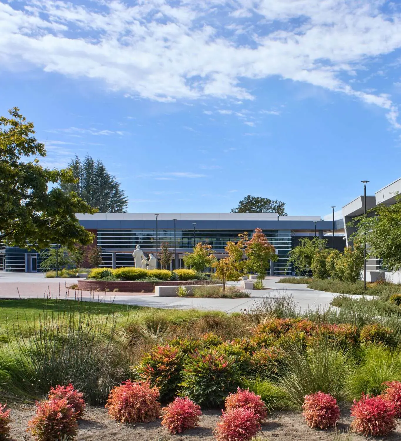 View of Quad with the Holy Cross Family statue, a powerful representation of our faith,  serving as a daily reminder of our commitment to our Holy Cross values.