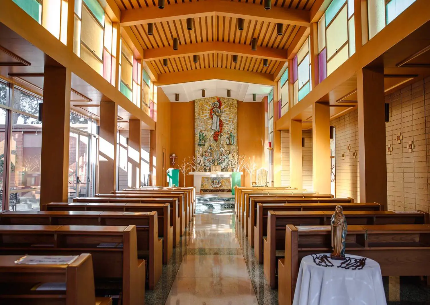 Altar inside of Saint Joseph Chapel with a tile mosaic depicting Christ as educator, educated and the Bread of Life.