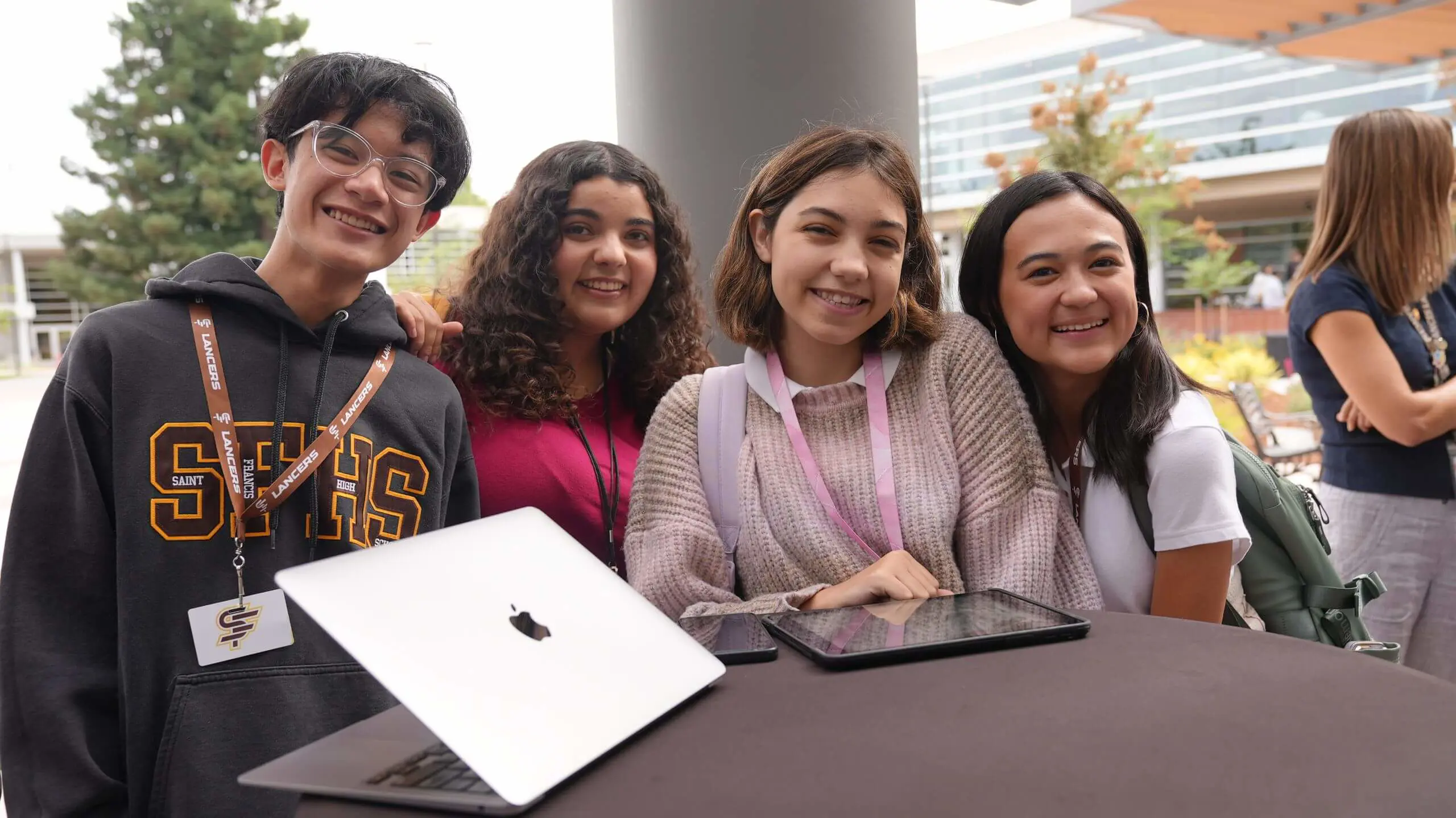Students posing happily for a photo, showcasing their camaraderie in a lively environment.