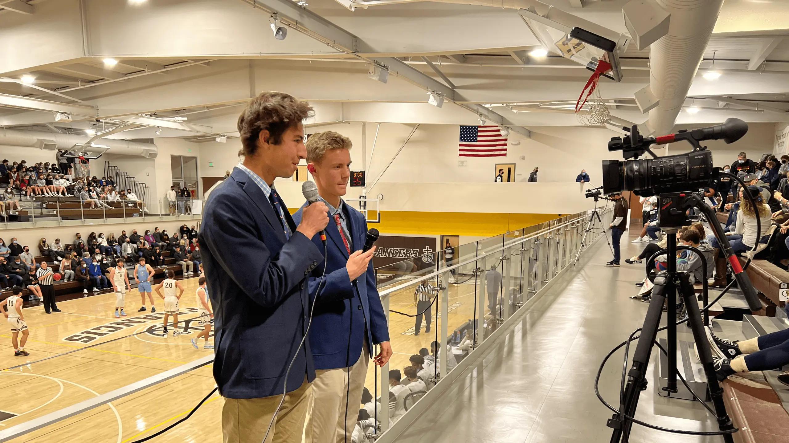 Student Broadcasters for Lancer Live broadcasting varsity basketball live.